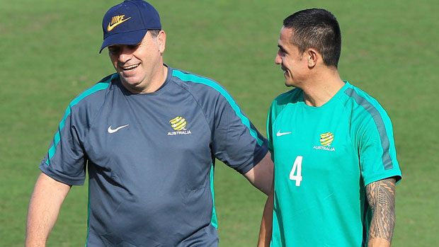 Ange Postecoglou and Tim Cahill during a Caltex Socceroos training session.