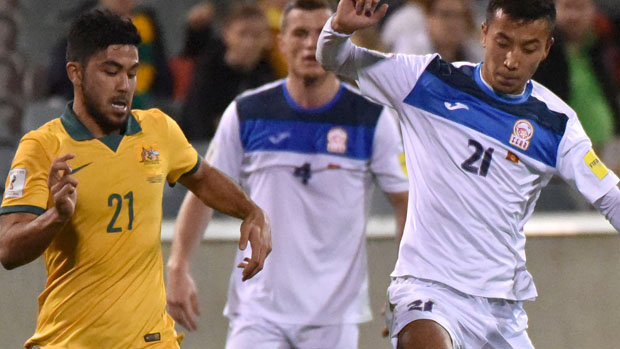 Mass Luongo fights for the ball with a Kyrgyzstan defender.