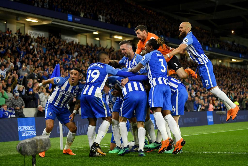 Mathew Ryan celebrates with his teammates after beating Manchester United