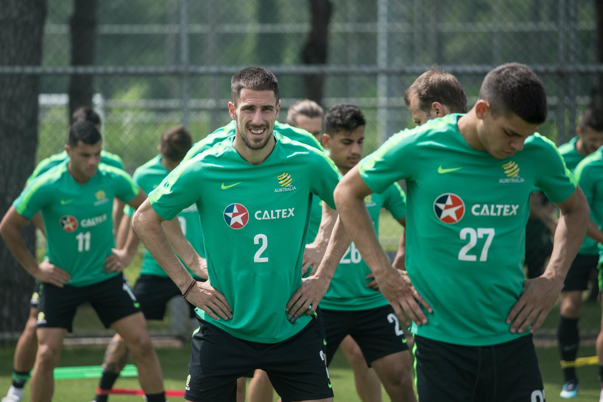 Milos Degenek going through some stretches.