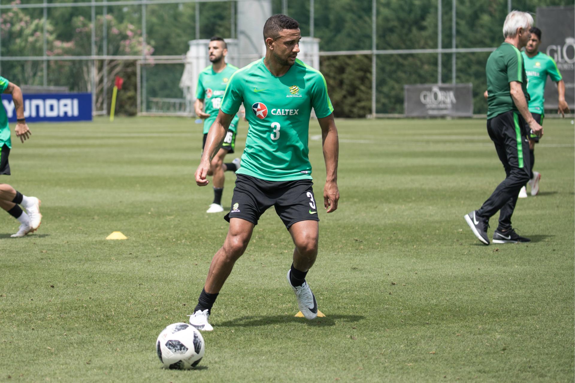 Caltex Socceroos defender James Meredith looks to turn into space.