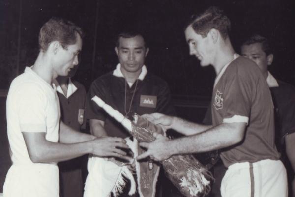 Pat Hughes exchanging penants.