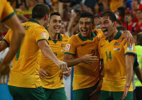 Caltex Socceroos celebrate James Troisi's winning goal in the Asian Cup final.