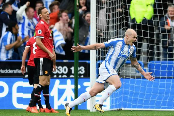 Aaron Mooy celebrates scoring against Manchester United.