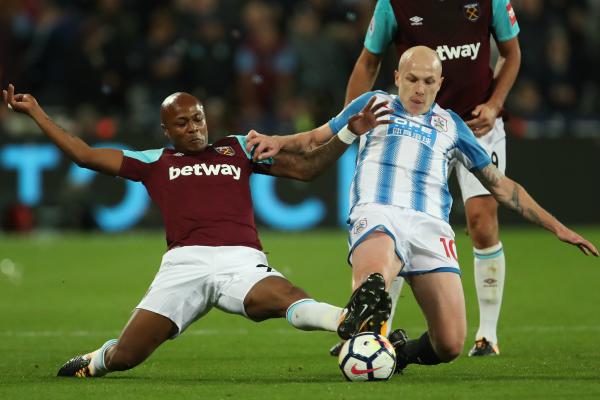 Aaron Mooy gets a tackle in against West Ham.