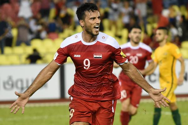 Omar Al Soma celebrates his goal against the Caltex Socceroos on Thursday night.