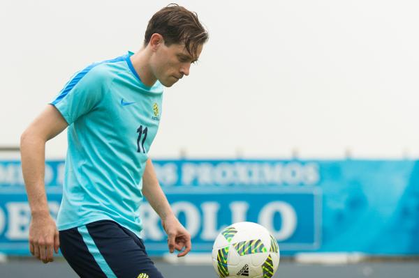 Craig Goodwin on the raining pitch in Honduras.