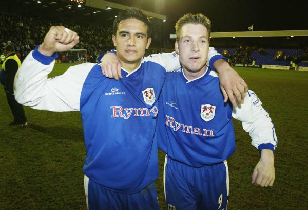 Tim Cahill and Neil Harris