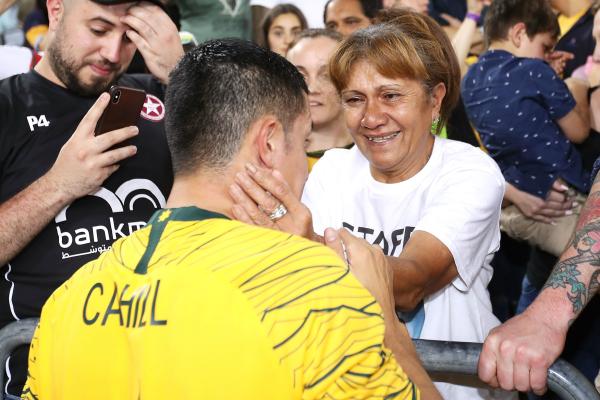 Tim Cahill with his mum Sisifo after his last match for the Caltex Socceroos