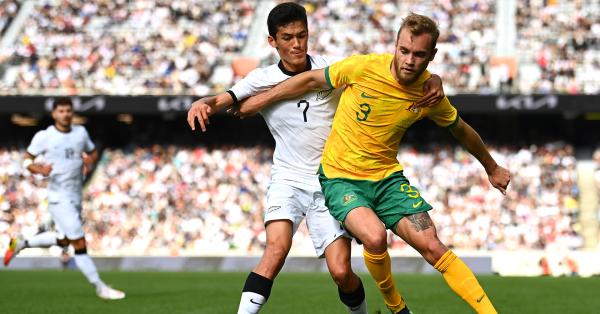Nathaniel Atkinson of the Socceroos competes with Elijah Just of the Whites during in the match between the All Whites and Socceroos at Eden Park on September 25, 2022 in Auckland