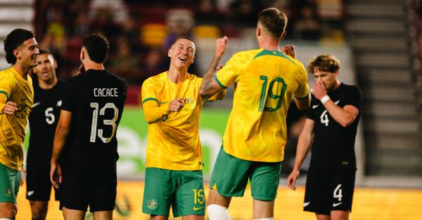 Mitch Duke and Harry Souttar attempt to claim the same goal against New Zealand