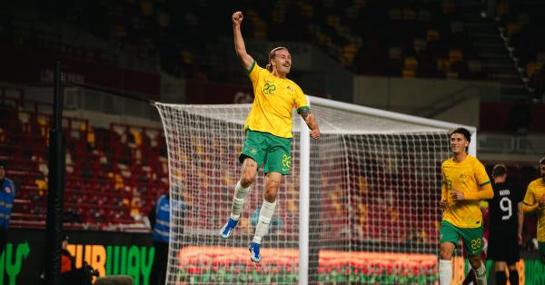  Jackson Irvine celebrates after scoring against New Zealand at Gtech Community Stadium