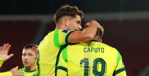 Max Caputo celebrates scoring against Cuba