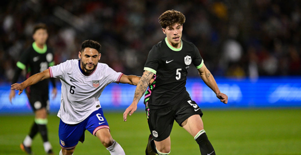 COMMERCE CITY, COLORADO - OCTOBER 14: Jordan Bos of Australia is challenged by Cristian Roldan of United States during the International Friendly match between United States and Australia at Dick's Sporting Goods Park on October 14, 2025 in Commerce City, Colorado. (Photo by Dustin Bradford/Getty Images)