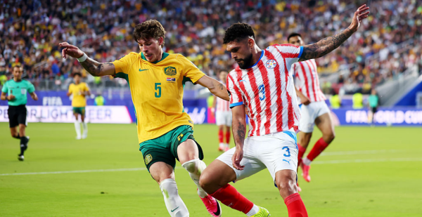 SANTA CLARA, CALIFORNIA - JUNE 25: Jordan Bos #5 of Australia competes for the ball against Omar Alderete #3 of Paraguay during the FIFA World Cup 2026 Group D match between Paraguay and Australia at San Francisco Bay Area Stadium on June 25, 2026 in Santa Clara, California. (Photo by Dean Mouhtaropoulos/Getty Images)