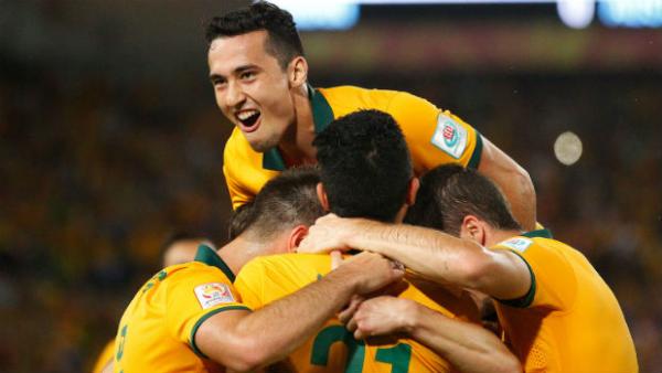 The Socceroos celebrate Robbie Kruse scoring against Oman.