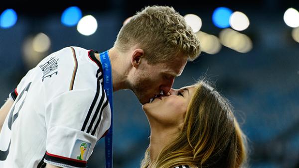 Andre Schurrle shares a moment with his girlfriend following Germany's World Cup win.