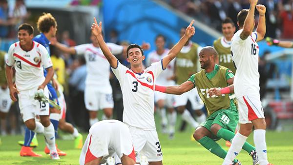 Costa Rica celebrate their 1-0 victory over Italy.