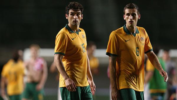 Socceroos Mile Jedinak and Matthew Spiranovic in action against Croatia.