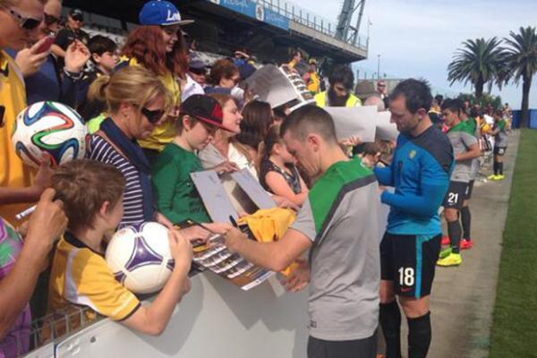 The Socceroos signing autographs at today's Fan Day at Central Coast Stadium.