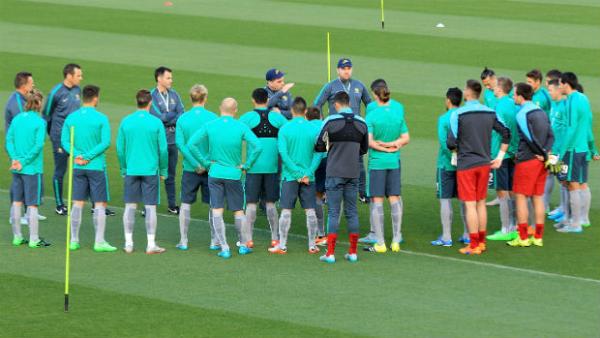 The Socceroos squad take instructions from coach Ange Postecoglou in Perth.