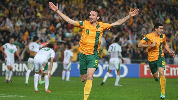 Socceroo Josh Kennedy celebrates scoring against Iraq in a World Cup qualifier.