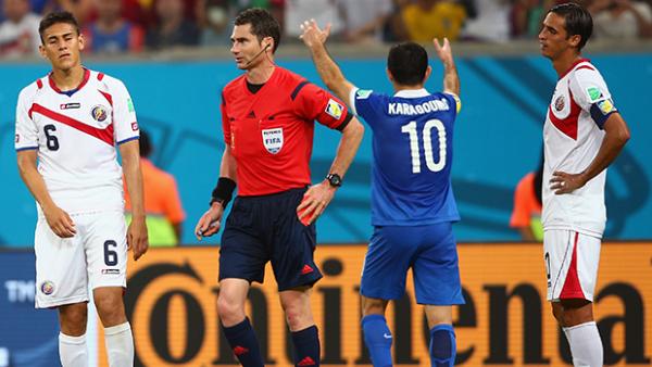 Oscar Duarte of Costa Rica walks off the pitch after receiving a red card from referee Benjamin Williams.
