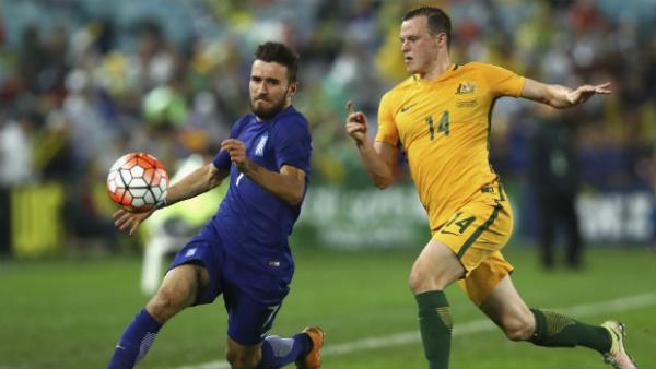 Brad Smith shadows Greece's Giannis Gianniotas at ANZ Stadium.