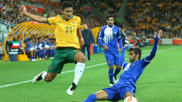 Massimo Luongo and Khaled Alqahtani vie for the ball at Melbourne Rectangular Stadium.