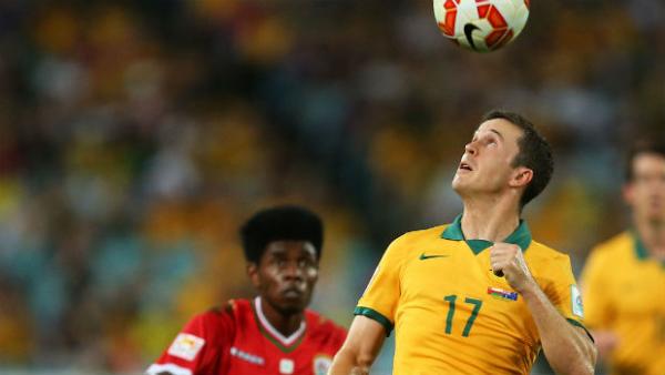 Socceroos midfielder Matt McKay heads the ball against Oman at the Asian Cup.