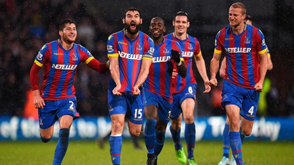 Mile Jedinak celebrates scoring for Crystal Palace against Liverpool.