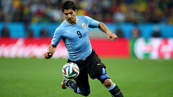 Suarez controls the ball during Uruguay's 2-1 win over England.