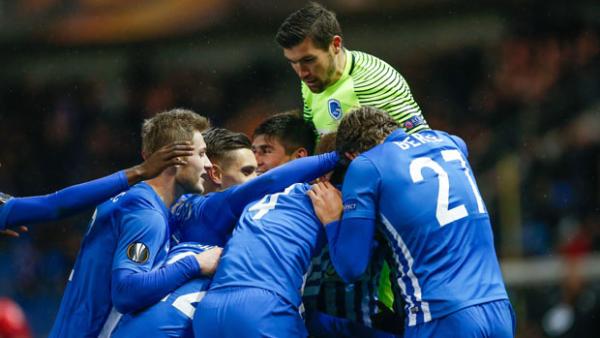 Goalkeeper Mat Ryan celebrates with his Genk teammates.