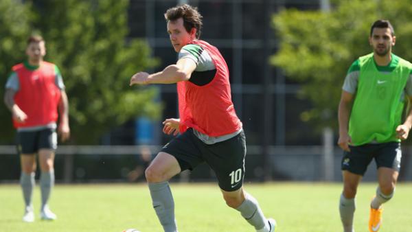 Robbie Kruse dribbles with the ball during a Socceroos training session in Melbourne.