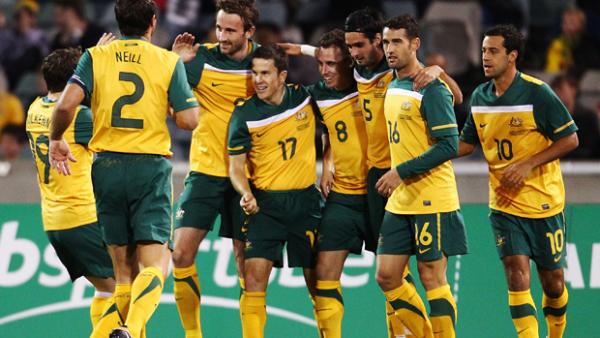 The Socceroos celebrate Luke Wilkshire's early goal.