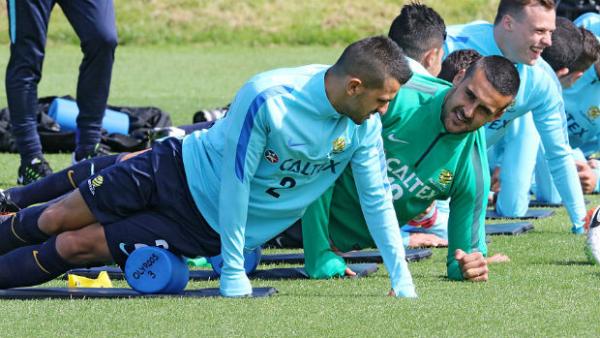 The Caltex Socceroos stretch before a training session in Sunderland.