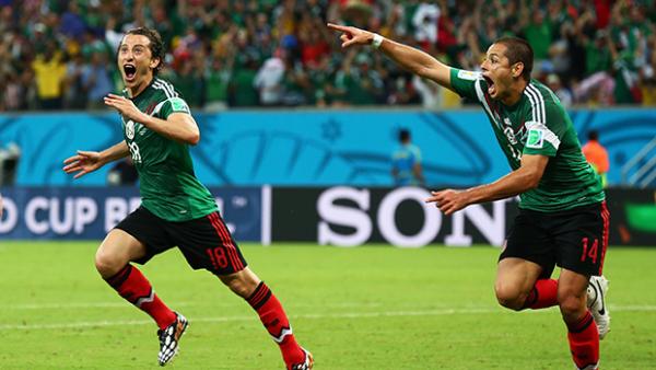 Mexico's Andres Guardado and Javier Hernandez celebrate their team's second goal against Croatia.