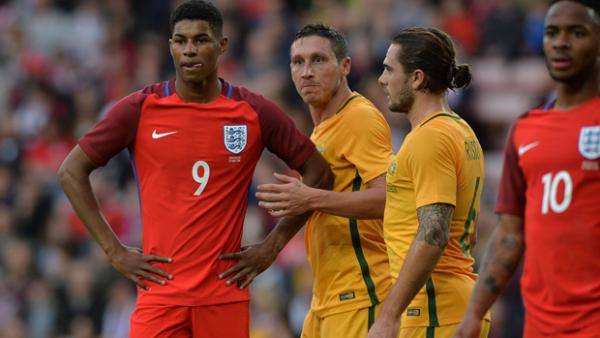 Mark Milligan competes with England young gun Marcus Rashford.