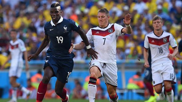 Paul Pogba competes with Bastian Schweinsteiger during their quarter-final.