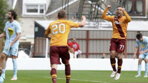Striker Scott McDonald celebrates scoring for Motherwell in Scotland.