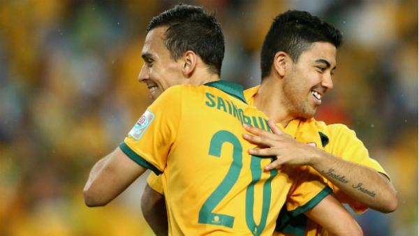 Trent Sainsbury and Massimo Luongo celebrate the Socceroos win over Oman.