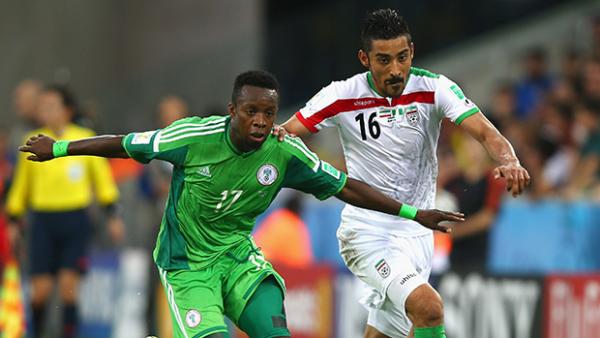 Ogenyi Onazi of Nigeria competes for the ball with Reza Ghoochannejhad of Iran.