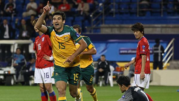Socceroos captain Mile Jedinak celebrates scoring against Korea Republic at the 2011 Asian Cup.