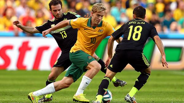 Ben Halloran takes on Juan Mata and Jordi Alba during Australia's clash with Spain.