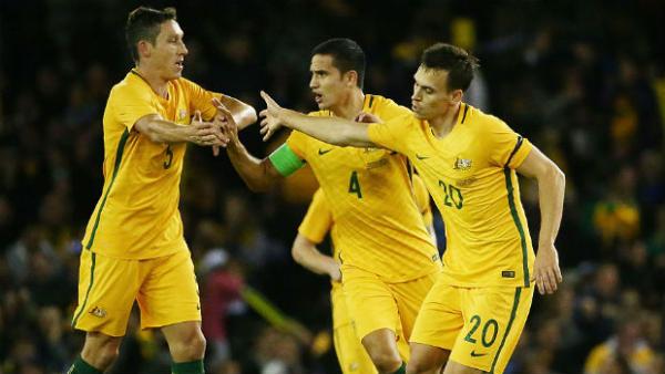 Trent Sainsbury celebrates scoring against Greece with Mark Milligan and Tim Cahill.