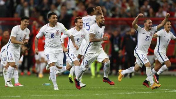Chile players celebrate after their dramatic penalty shootout win over Portugal at the Confederations Cup.