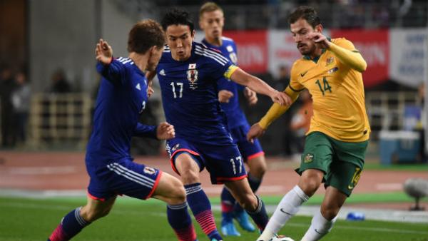 Socceroo James Troisi tries to allude Japan's defence in November's friendly.