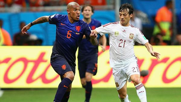 De Jong holds off Spain's David Silva.