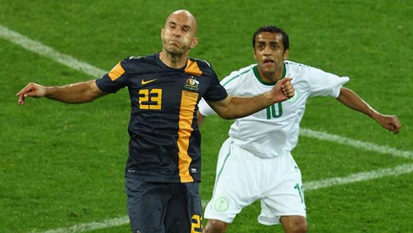 Mark Bresciano heads the ball during the Socceroos last outing against Saudi Arabia.