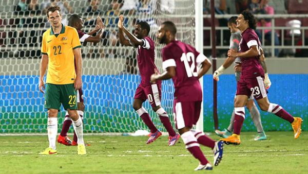 Qatar celebrate scoring the only goal of the game against the Socceroos.